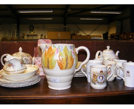 A Clarice Cliff jug, together with commemorative ceramic ware and other 
