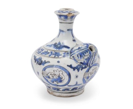 To Be Sold With No ReserveA blue and white pottery Kendi,Safavid Iran, 17th century,The bulbous body rising from a short stra
