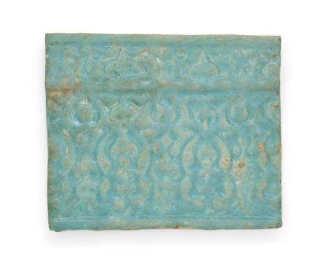 To Be Sold With No ReserveA rectangular turquoise glazed moulded pottery tile,Kashan, Iran, 12th centuryWith repeating rising