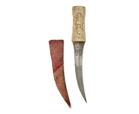 A walrus ivory hilted dagger,Qajar, Iran, 19th century,The double fullered curved blade engraved with a feline pouncing on a 