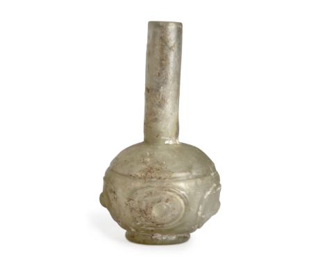 To Be Sold With No ReserveA clear glass wheel cut spherical bottle,10th century A.D.,On short foot, with long straight neck, 