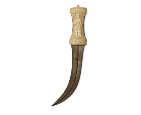 A carved walrus ivory hilted curved and double edged dagger (jambiyya),Qajar Iran, 19th century and later,The hilt engraved w