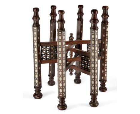 A mother-of-pearl inlaid wood table base,Syria, 20th century,Three pairs of hexagonal feet linked by two similarly inlaid rec