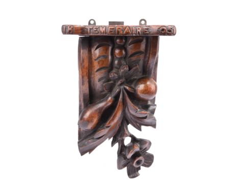 H.M.S. Temeraire: a carved oak wall bracket purported to be made from her timber, scrolling bracket carved with leaves and ha