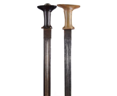 λ Ethiopia: Menelik II: two swords, the first with broad double edged blade 29.5 in., twin fullers with etched decoration, th