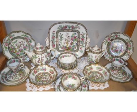A Coalport Indian Tree pattern matched part table service, comprising globular teapot, shaped bread plate, cups and saucer, e