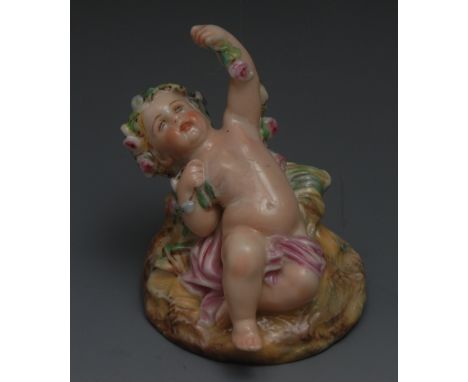 A Royal Worcester cherub, reclining, scantily draped, wearing a floral chaplet and holding a garland, 8cm high, impressed mar