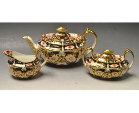 A Royal Crown Derby Imari 2451 pattern boat shaped teapot and cover, two handled sucrier and cover, milk jug, printed marks i