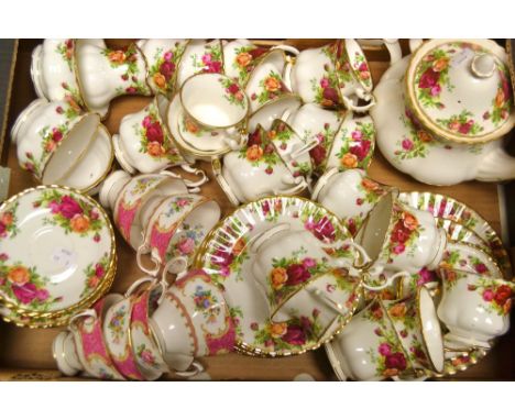 A Royal Albert Old Country Rose pattern tea and table service including Twenty assorted tea and coffee cups, fourteen saucers