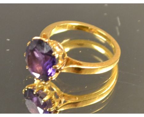 A 19th century high carat gold ring, set with a single faceted amethyst, 10mm diam, unmarked, 3.1g, ring size G