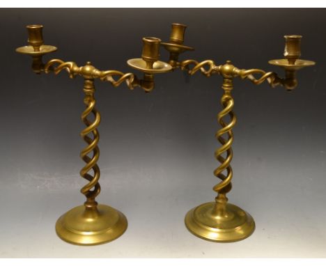 A pair of Jacobean Revival brass open twist two-light candelabra, c.1900
