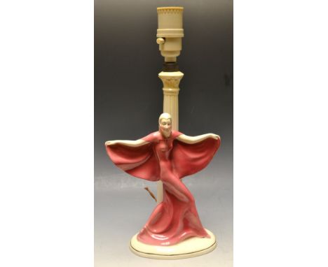 An Art Deco continental figural table lamp, she stands in flowing pink robes before a corinthian column, 35.5cm high, c.1930