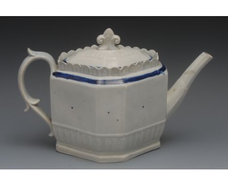 An 18th century pearlware panelled teapot, the base in relief with stiff leaves, banded in cobalt blue, leafy finial, 19cm hi