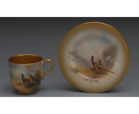 A Royal Worcester cabinet cup, painted by Jas Stinton, signed, with pheasants, the interior in gilt, printed crown and circle