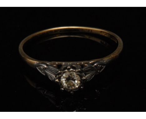 A diamond solitaire ring, round brilliant cut diamond, approx. 0.36ct, platinum crown claw, 18ct yellow gold shank, size X, 2