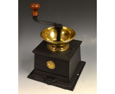 An early 20th century cast iron brass mounted coffee grind, Wolverhampton Clark and Co Light Coffee Mill, turned mahogany kno