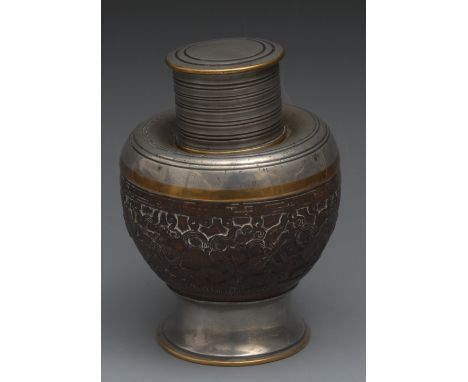 An 18th century Chinese coconut tea caddy, carved in relief with precious objects, flowers, scrolls, and trellis, push-on cov