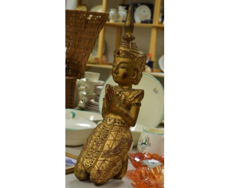 A Tibetan jeweled wooden figure of a deity kneeling, a brass table top pipe base, a lamp, etc