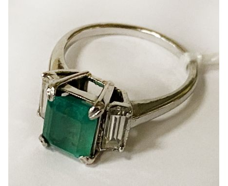 18 CARAT WHITE GOLD RING SET WITH EMERALD CUT NATURAL EMERALD 1.54CT APPROX &amp; 2 BAGUETTE CUT NATURAL DIAMONDS ON THE SIDE