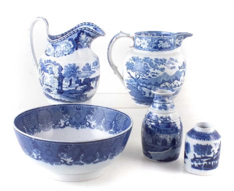 Collection of blue transfer ware, including two jugs, bottle vase, bowl and a teacaddy, first half of the 19th century.The ta