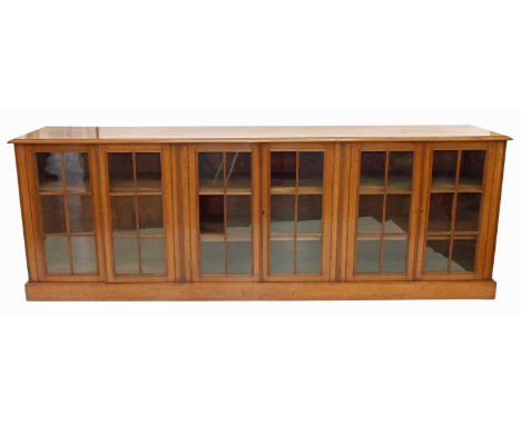 Early 20th-century mahogany bookcase, the rectangular top above six glazed doors, each with six clear glass panels, three ree