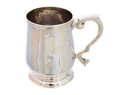 A George III silver mug, of slightly tapered form, with scrolling handle and circular spreading foot, hallmarks for Richard R