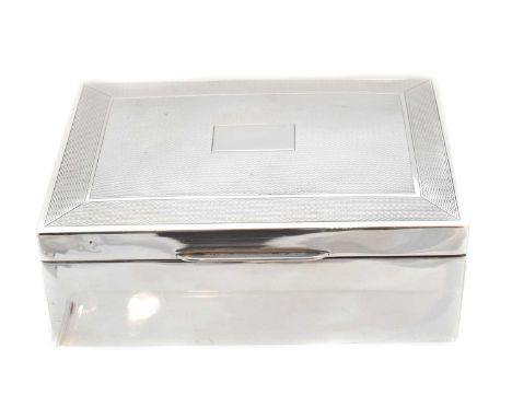 A George VI silver cigar box, of typical form with engine turned decoration, hallmarks for Harman Brothers, Birmingham, 1951,