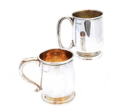 Two silver mugs, each of typical form, raised on a circular spreading base, together with a napkin ring, gross weight 12.99oz