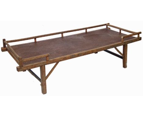 20th century Chinese hardwood day bed, woven grass panel with shallow gallery, all standing on four molded legs.length 196cm 