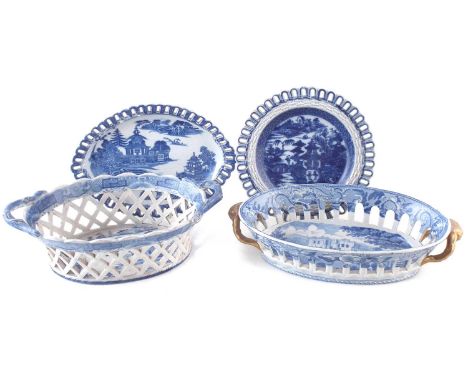 Two pierced blue transfer baskets and two stands, the circular stand marked Spode, early 19th century. The largest measures 2