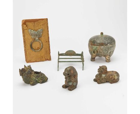 Comprising two gilt lacquered jade beasts, a cast bronze beast-form water dropper, a bronze oil lamp, a cast bronze loose rin