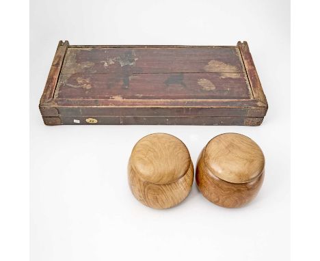 The hinged folding board in cases thirty-two carved playing tokens; together with two Chinese carved hardwood boxes filled wi