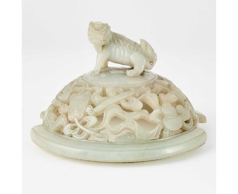 The domed, openwork cover carved to show 'bajixiang' emblems encircling a qilin finial.(Diameter 5 1/2 inches)No condition re