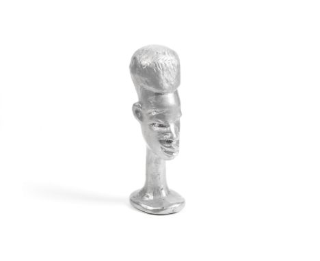 David Bowie (British, 1947-2016): A Pagan Head amulet,1995,a metal amulet statuette by David Bowie marked on the base by Bowi