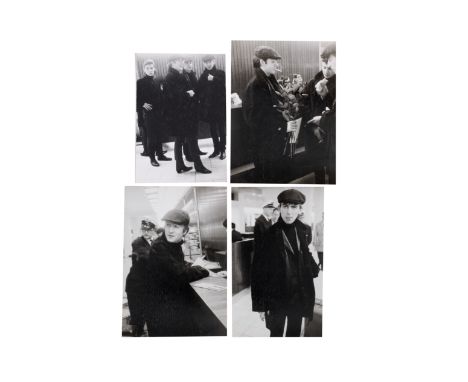 The Beatles: A group of rare photographs of the Beatles at Hamburg Airport,2nd June 1962,believed unpublished, thirty-one bla