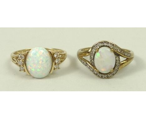 A 9ct gold and opal ring in a curving surround of diamonds, size R, 2.6g, and a 14ct gold and opal ring with zircon set shoul