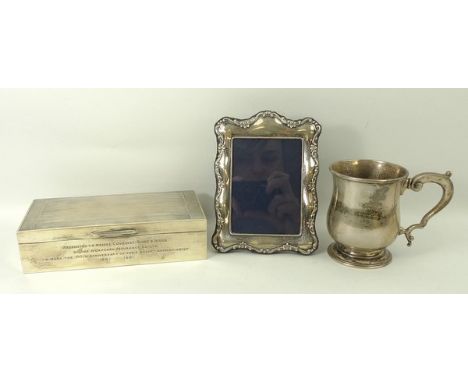 A silver tankard of baluster form, Newcastle 1927, 5.46toz, a silver strut photograph frame, Sheffield 1988, and a silver cig