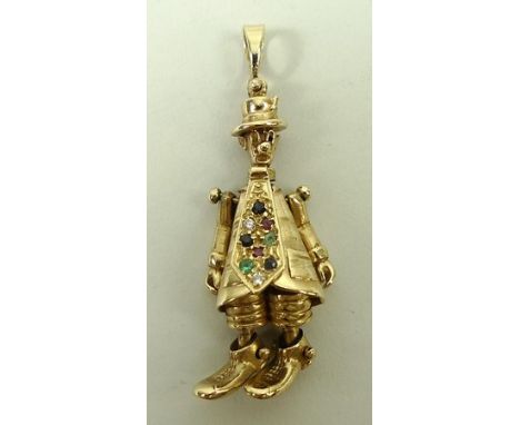 A 9ct gold clown pendant with a gem set kipper tie and reticulated arms and legs, 12.2g.