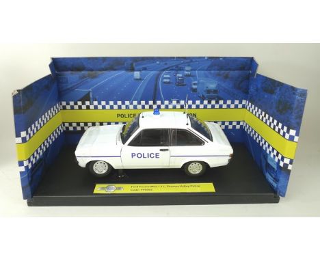 A Model-Icons Police Vehicle Collection model of a Ford Escort XR3i, Cambridgeshire Constabulary, a Ford Escort mk2 1.1L, Tha