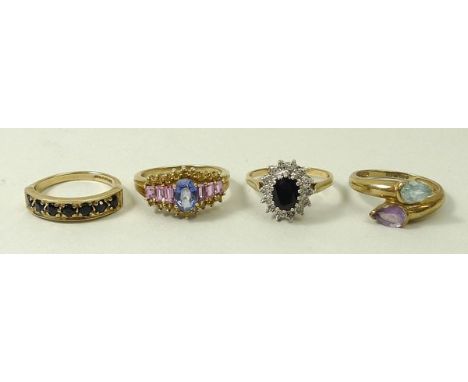 A 9ct gold, blue, pink and yellow topaz cluster, 9ct gold and sapphire oval ring in a diamond surround, 9ct gold and sapphire