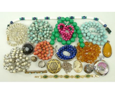 A quantity of costume jewellery including beads, a jade bracelet and brooches.