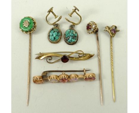 A group of brooches and stick pins, comprising a 9ct gold and garnet scrolled bar brooch 1.5g, a stick pin set with jade and 