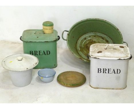 A green mottled enamel baby bath, together with three enamel bread bins with lids, a commode pail, bread board and other kitc