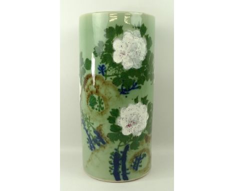 A Chinese / Japanese celadon glaze stick stand, early 20th century, painted with flowers, 35cm high.