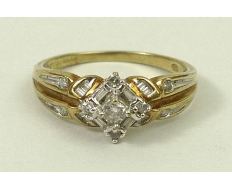 A 9ct gold and diamond ring of stepped form set with brilliant and baguette cut diamonds, approximately 0.25ct, size R, 2.6g.