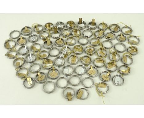 A quantity of titanium rings, sizes J to R/S, 172.3g. (66)