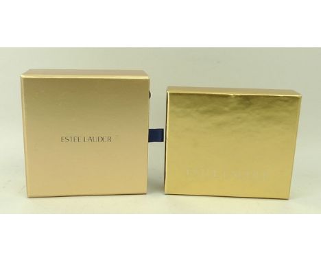 An Estée Lauder compact, Taurus, in original velvet bag and box, together with Estée Lauder After Hours Slim Gold Compact, Lu