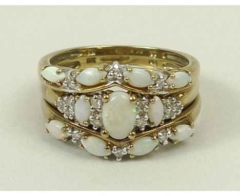 A 9ct gold and opal triple ring set, comprising a three stone ring and two curving four stone rings, each set with diamonds a