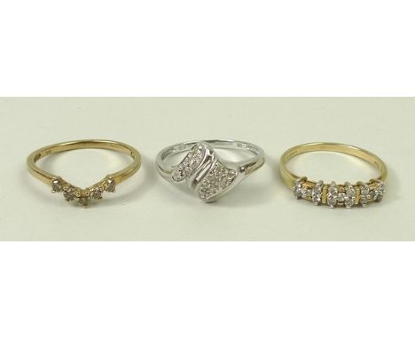 A 14ct gold and diamond ring set with single and pairs of diamonds at intervals, size R, 2.1g, 9ct white gold and diamond swi