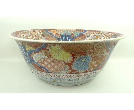A Japanese porcelain bowl or basin, late 19th century, decorated in imari colours with chrysanthemums, birds and motifs, Zosh